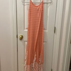 Free people, size, medium peach, and cream colored stripes lots of ruffles